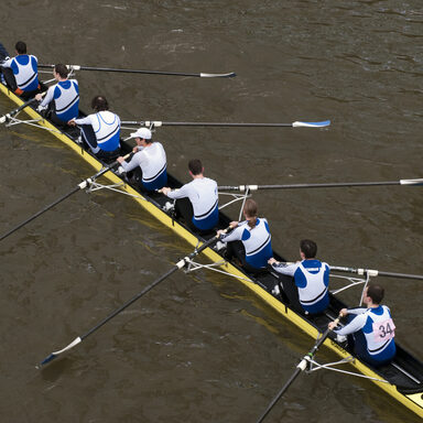 Rowers in eight-oar rowing boat on River Thames in London, England – “The Head of the River Race”